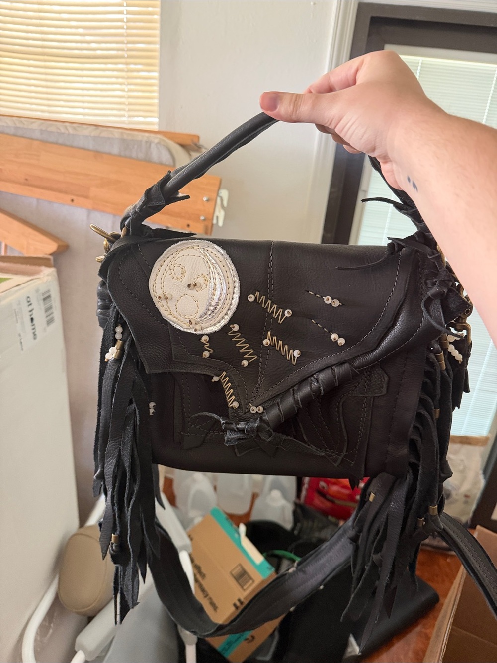 Black Fringe Leather Top-Handle Bag with Embellished Accent